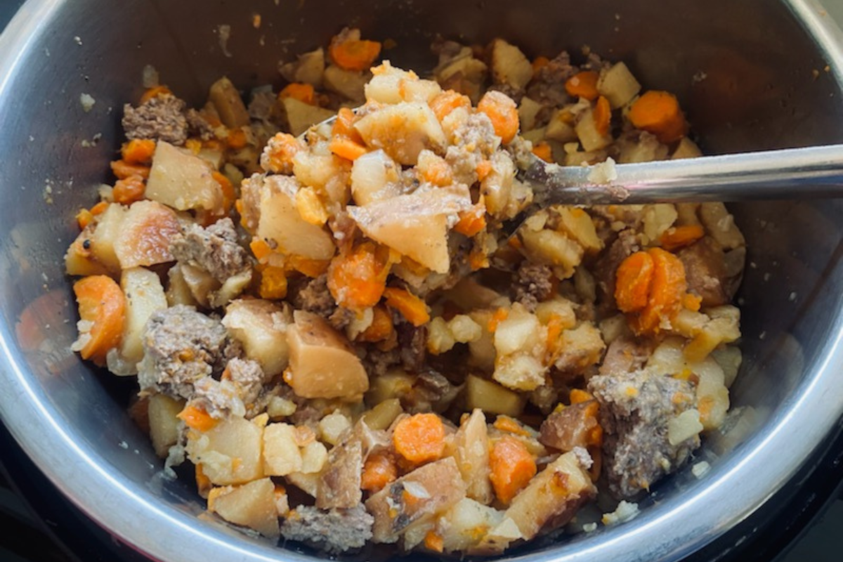 Potatoes, carrots, ground beef and delicious spices mixed for an easy insta pot shepherds pie
